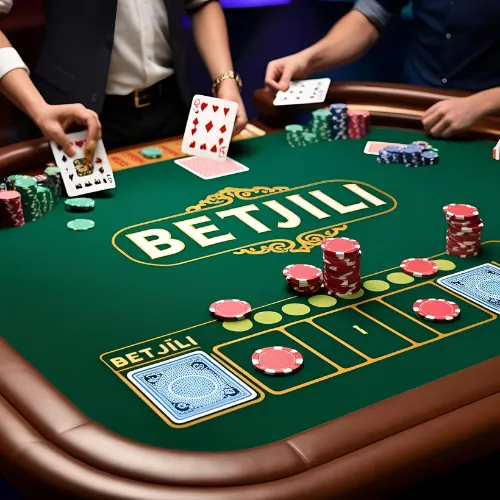 Online casino table with cards, chips, and Betjili logo.